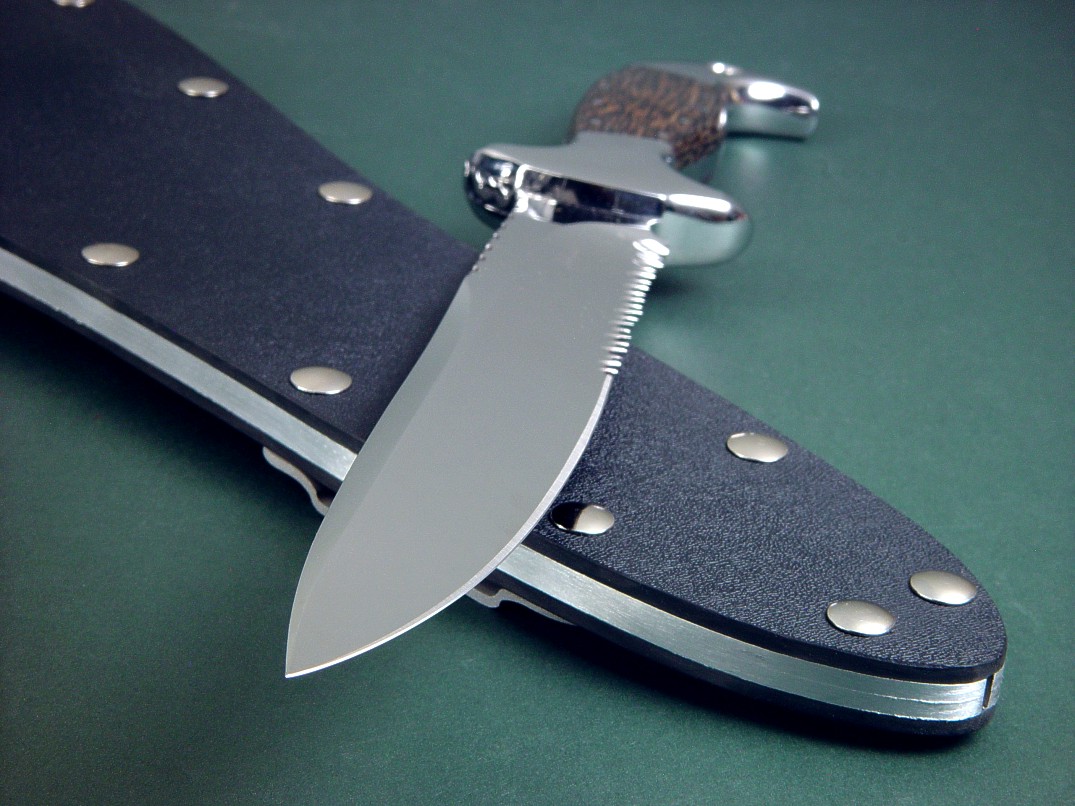 "Macha EL" obverse side view in 440C high chromium stainless steel blade, 304 stainless steel bolsters, Black Palm Wood hardwod handle, tension fit kydex, aluminum, stainless steel sheath