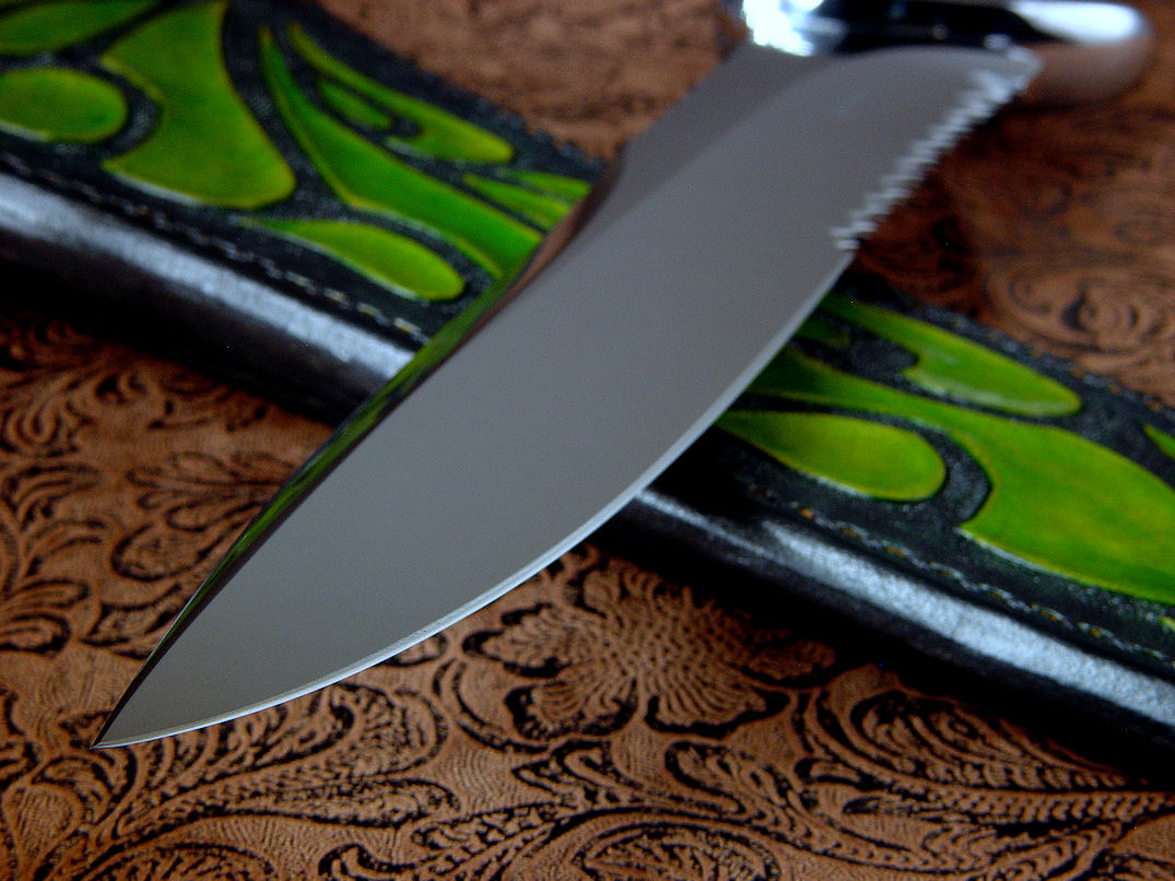 "Macha Navigator EL" blade point detail  in 440C high chromium stainless steel blade, hand-engraved 304 stainless steel bolsters, Plasma Agate gemsone handle, hand-carved, hand-dyed leather sheath