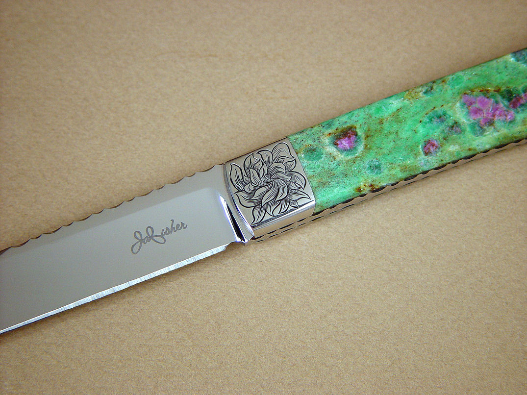 "Shaula" obverse side view in ATS-34 high molybenum stainless steel blade, hand-engraved 304 stainless steel bolsters, Ruby in Fuchsite gemstone handle, lizard skin inlaid in hand-carved leather shoulder