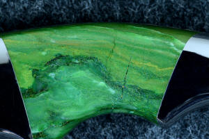 "Raptor" obverse side gemstone handle scale detail, 6 power enlargement showing complex inclusions of fuchsite mica and chalcedony in rare Budstone (Verdite)