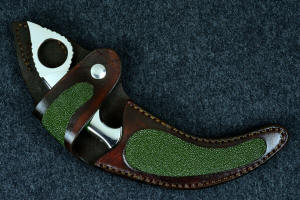 "Raptor" sheathed view. Sheath is deep and protective for radically curved knife blade and handle, and is inlaid with green rayskin, tough and durable