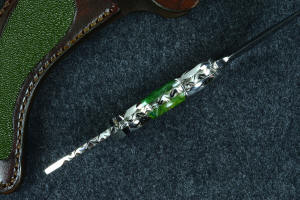 "Raptor" inside handle tang view, with deeply contoured finger grooves and bolsters, dovetailed fittings and gemstone handle scales, fully tapered tang