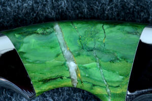 "Raptor" reverse side gemstone handle detail, 6X enlargement, showing quartz and other inclusions of budstone (Verdite) from South Africa