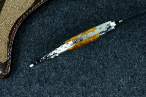 "Raptor" fine handmade custom karambit knife, spine filework detail with fully tapered tang and dovetailed bolster and handle scale detail