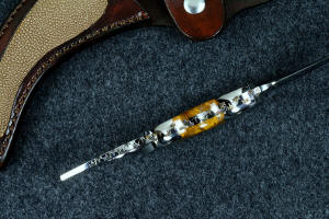 "Raptor" fine handmade custom knife inside handle tang detail showing full filework, contoured bolsters and gemstone handle, dovetailed handle set